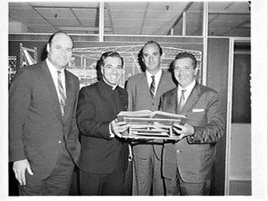Presentation of a Bible to a priest by Alitalia