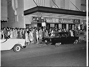 Night exterior of the Century Theatre, 1962, advertisin...