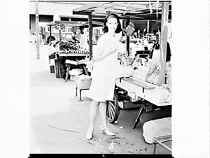 Woman shopping at Ellen Willcher's fruit barrow, Circul...