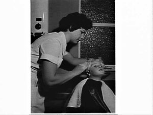 Girl having her hair cut, Reg Andrews hair studio