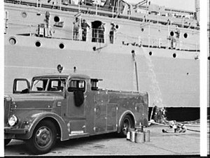 NSW Fire Brigade engine pumps out the boiler room of HM...