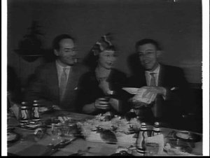 Googie Withers, John McCallum and Johnny Ladd at a dinn...