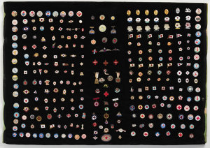 Item 26: [Collage of Red Cross badges, ca. 1980 / assem...
