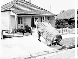 Pettit & Sevitt Carrying Ltd. deliver a refrigerator to...