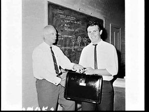 Hawker de Havilland presents a briefcase to the winner ...