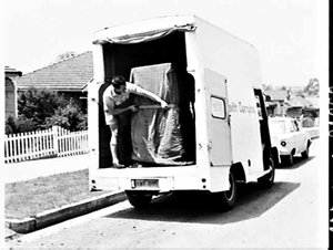 Pettit & Sevitt Carrying Ltd. deliver a refrigerator to...