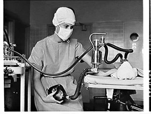 Anaesthetist with CIG equipment in the operating theatr...
