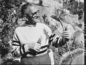 Reg Joyce with Strelitzia flower, Balmoral