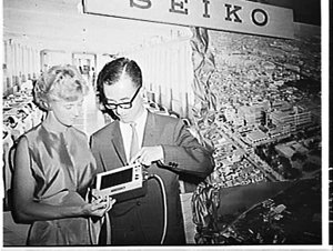 Betty Cuthbert presented with a Seiko watch and inspecting Seiko race-timimg clock, Japan Trade Centre, Sydney