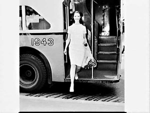 Woman steppingfrom a Governement bus, Sydney