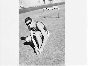 Geoff McNamara, hurdler, racing at E.S. Marks Field, Mo...
