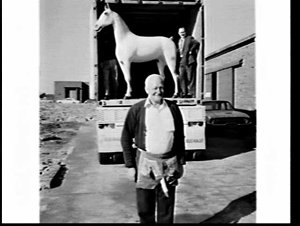 Unloading a life-size model of the White Horse Whisky l...
