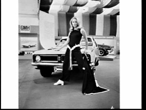 Fashion model poses with Holden car at the Motor Show, ...