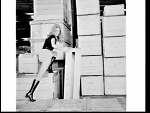 Fashion model in miniskirt and boots at the Overseas Containers (OCL) depot, Chullora