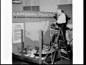 Unidentified geology professor photographs a lapidary e...