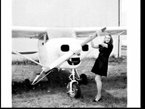 Woman with single-engine small aeroplane, Bankstown Air...