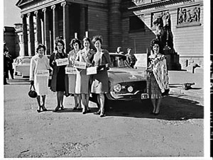 Miss Australia Quest entrants ride in a Ford Falcon and...