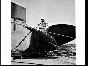 Cadet officer Les Mills sits on propeller import on the...