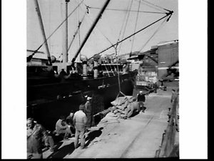 Loading rice in sacks onto the cargo ship Josephine, Py...