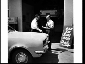 Man booking his Holden Kingswood in for a service at an...