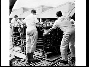 ICI ANZ drums being unloaded from a BOAC cargo flight, ...