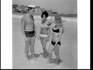 Beach inspector with women in bikinis, Bondi Beach