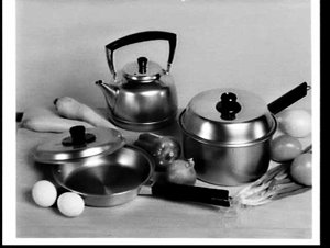 APA studio photograph of a saucepan, frypan and kettle