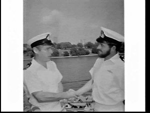 Presentation of a prize to an officer on the deck of HM...