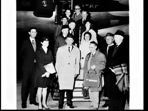 Group of Lithuanians and BOAC air hostess on the steps ...