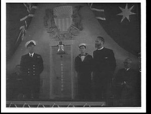 Orient Line officer presents the ship's bell from the O...