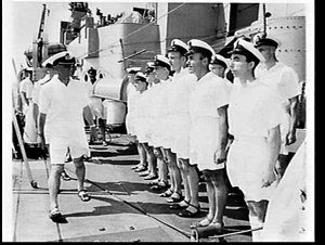 Captain inspecting the officers on HMAS Anzac at sea en...