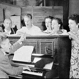 Singers of the National Opera of Australia at a piano r...