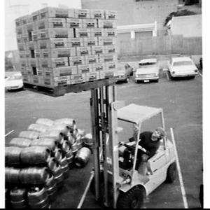 Mitsubishi fork-lift moving cartons of beer, Coogee Bay...
