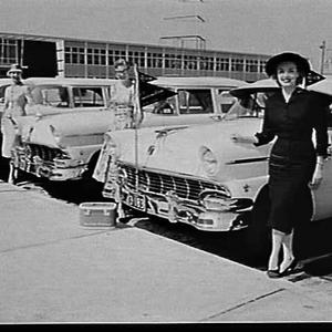 Miss Moorehead, American model, with models and Ford Cu...