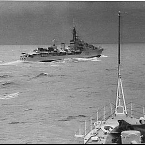 HMAS Arunta from the bows of HMAS Warramunga at sea off...
