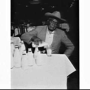 Albert Namatjira pouring milk in Anthony Hordern's rest...