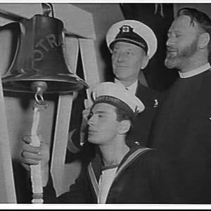 Orient Line officer presents the ship's bell from the O...