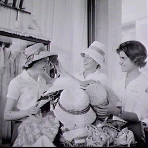 Runners Betty Cuthbert and Dixie Willis try on straw hats in the Olympic Village, Rome Olympic Games 1960