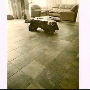Natural Stone slate floor with stone coffee table in a ...