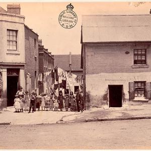 [Group of children, Ann's Place in Kent Street, 1875]