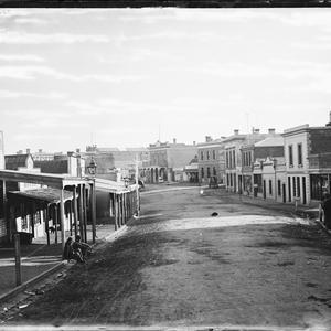Main street in Stawell showing a hotel, grocers shop, c...