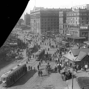Scene of Circular Quay showing trams, two hansom cabs, ...