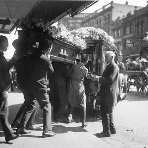 Loading the coffin into the hearse