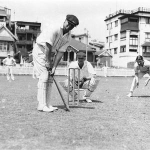 Cricketers at the wicket.  The batsman has VPCA on his cap.