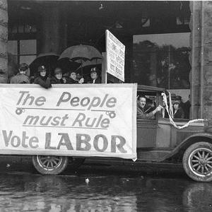 Election posters on old Chevrolet truck: "The people mu...