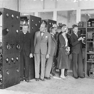 Sir Ernest Fisk shows visitors giant radio transmitter