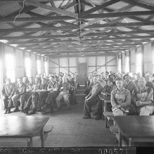 A large crowd of men waiting in a shed for food at Lidcombe, Auburn or Bankstown (taken for Charles A. Morgan, M.H.R.)