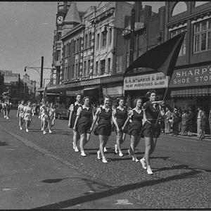 Floral march: basketball teams march along Hunter and K...