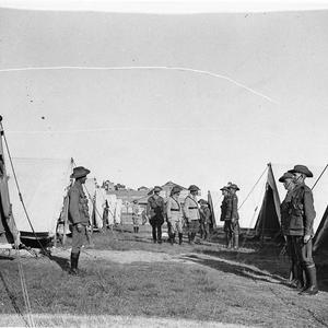 Inspection of troops in camp under canvas