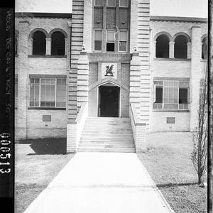 Sectional view of entrance; showing the school crest, N...